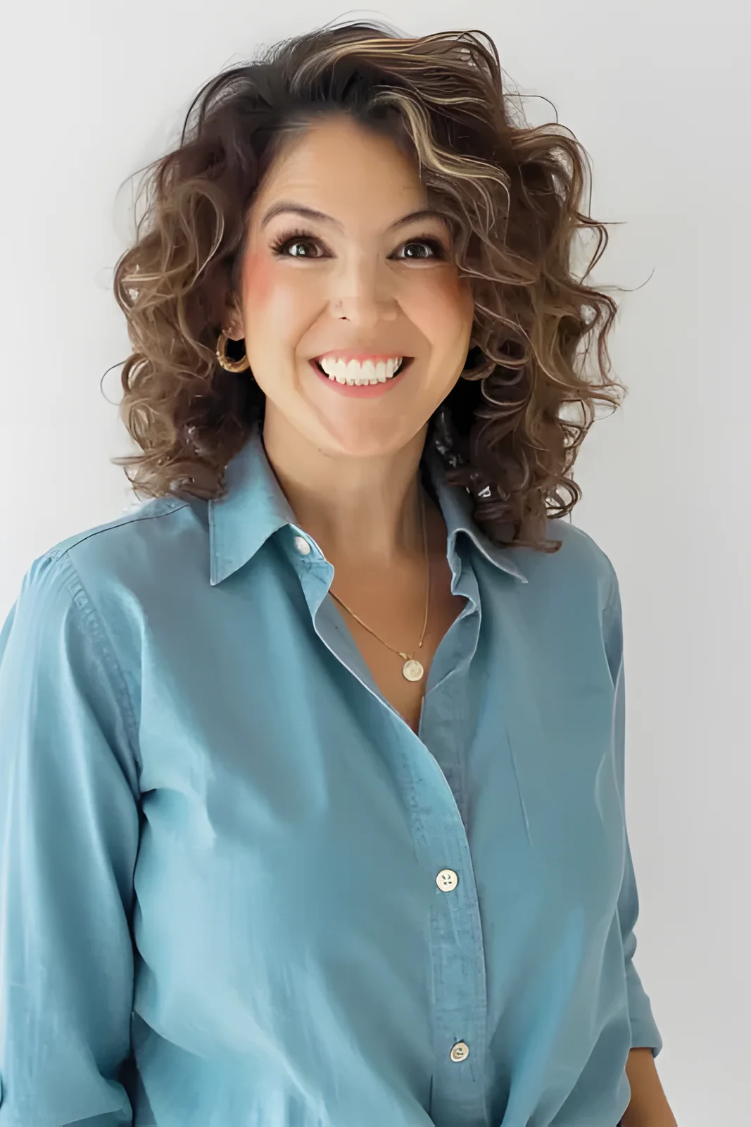Jessica Doyle-Mekkes in a chambray shirt, smiling.