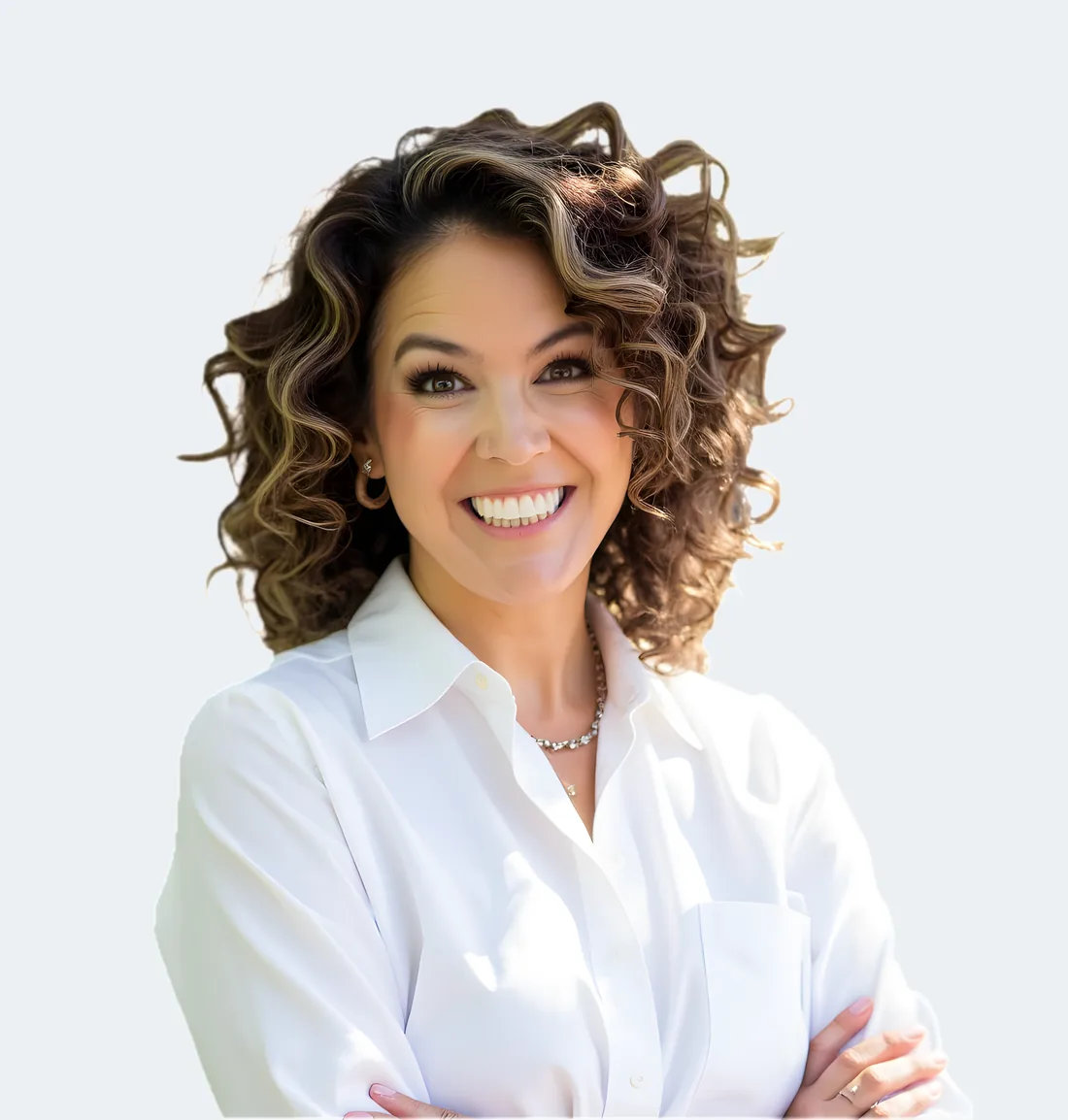 Jessica Doyle-Mekkes in a white button-down shirt, arms crossed, smiling.
